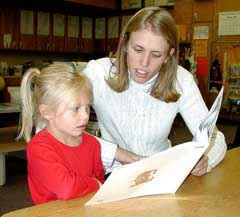 Volunteers help kids learn ABCs