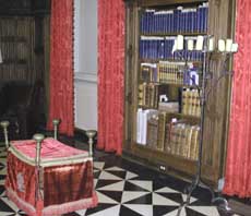 Library tour reveals old-English furniture, skull, caged archives