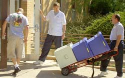 Administrators assist students in moving