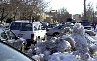 Parking and traffic slowed by snowdrifts