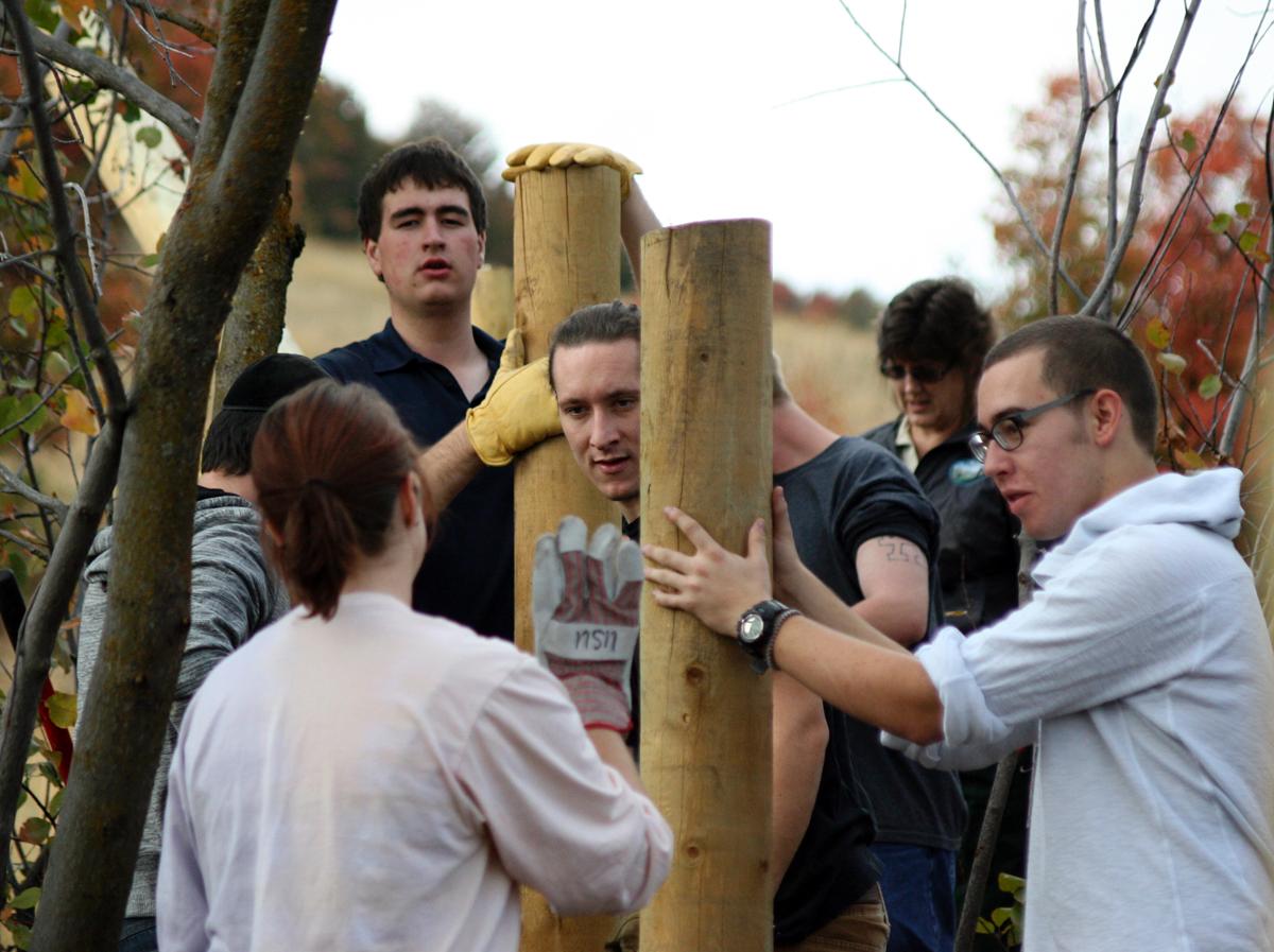 Volunteers and officials build fence to promote annual Public Lands Day