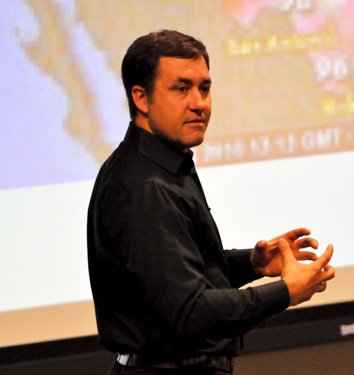 Speaker promotes book, explains opportunity cost