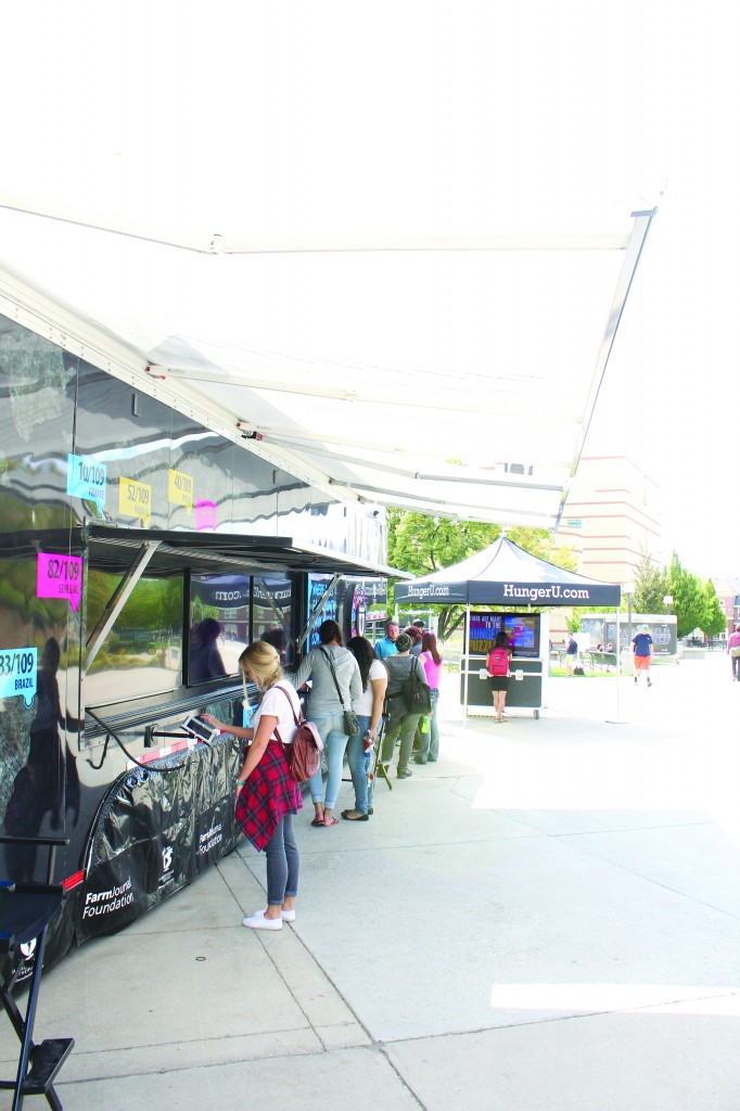 Students take Hunger U's world hunger quiz on the TSC pattio on Thursday. Jeffrey Dahdah photo