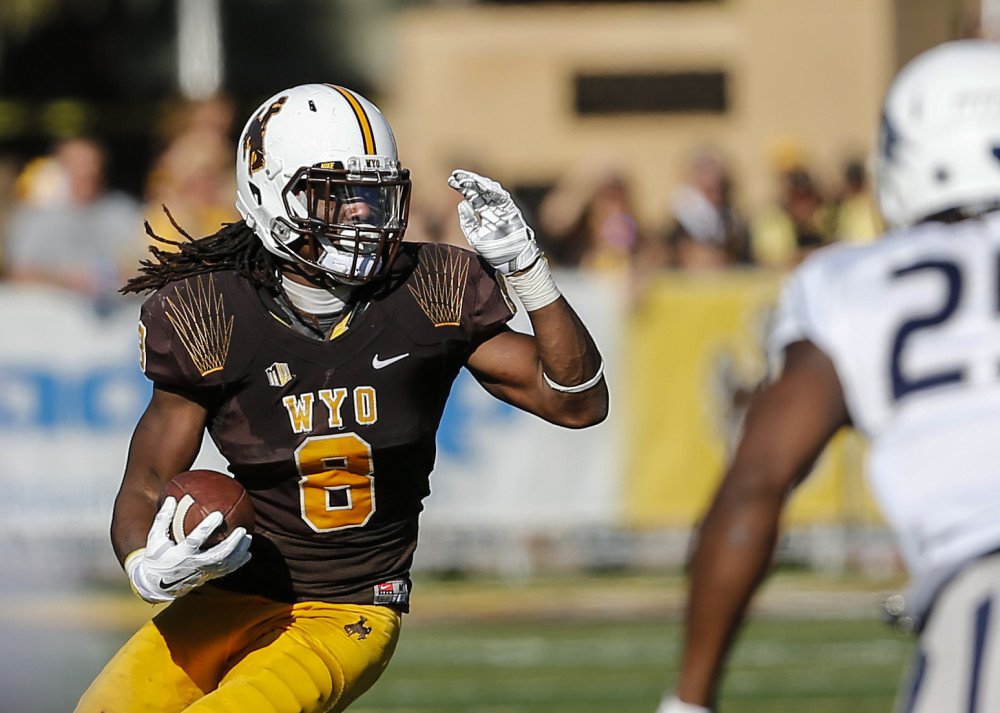 Oct 17, 2015; Laramie, WY, USA; Wyoming Cowboys running back Brian Hill (8) against Nevada at War Memorial Stadium. The Cowboys beat the Wolf Pack 28-21. Mandatory Credit: Troy Babbitt-UW Media-Athletics