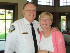 Chief Mecham poses with his wife, Darlene.