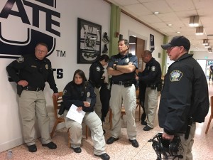 Chief Mecham, Sergeant Jessica Vahsholtz, Captain Steve Milne and Sergeant Joe Huish sit around before the Halloween Howl, USU's most popular party of the year, in October 2016. Photo courtesy of Heather Strong.