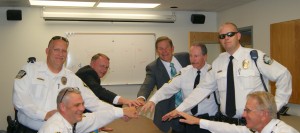 Sergeant Travis Dunn, Officer Andy Barnes, Chief Mecham, Captain Milne, Sergeant Joe Huish, Officer Travis Robson and Officer Kim Ellis prepare to enforce the law at Utah State University's 2015 graduation ceremony. Photo courtesy of Heather Strong.