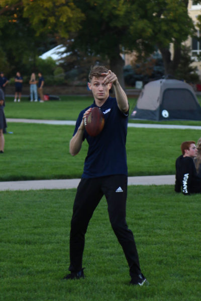 Conner Snow throws a football with friends. 